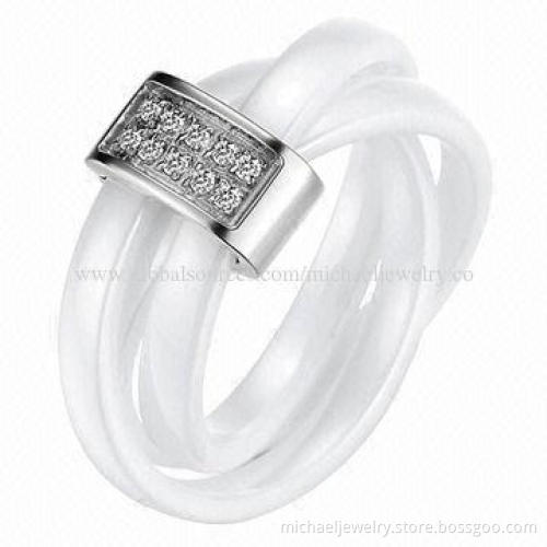 Ceramic rings with crystal and three white crossed together